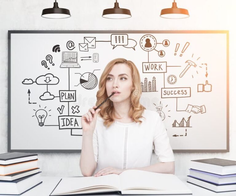 etudiante reflechissant devant des livres ouverts